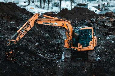 A Komatsu excavator working on a snowy construction site in Tromsø, Norway.